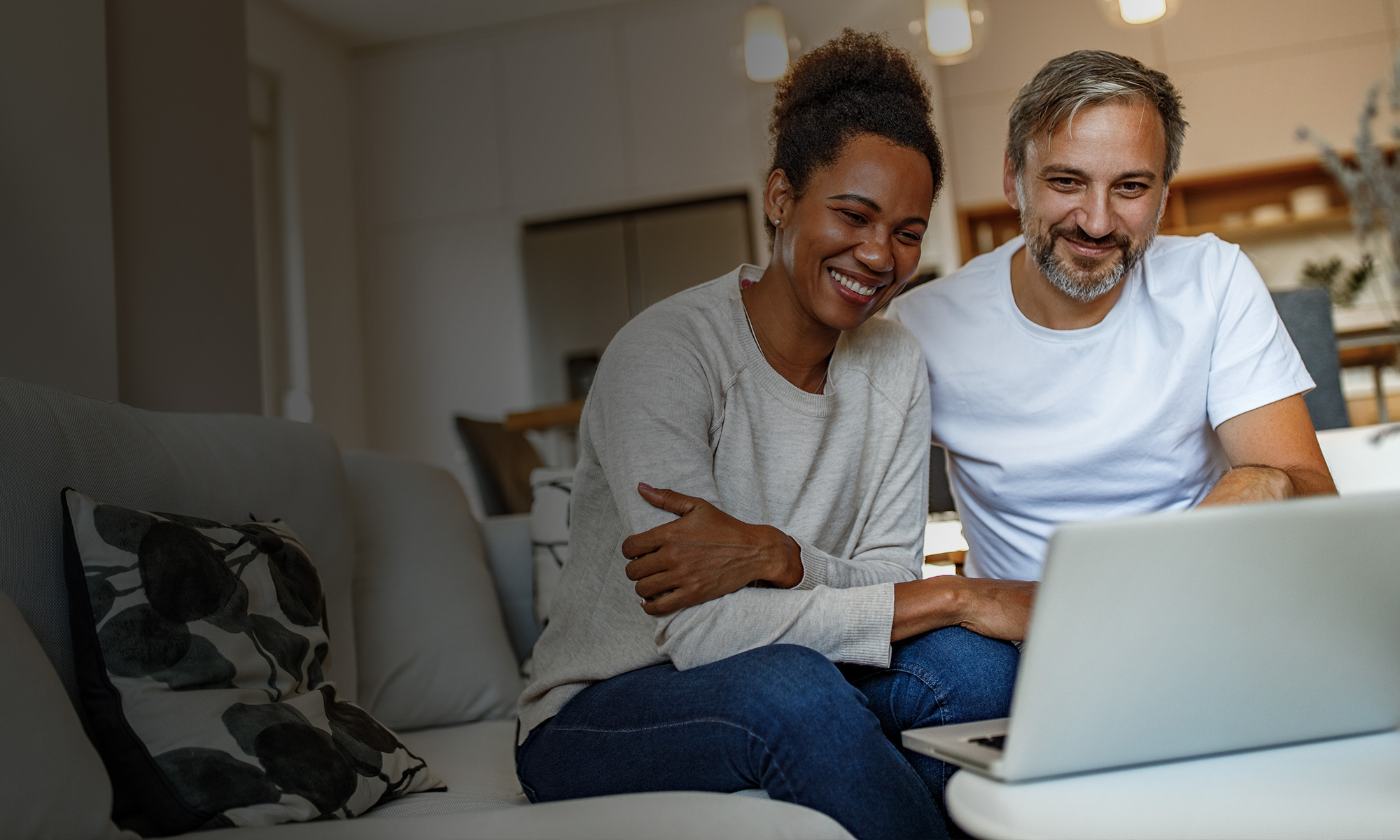 Women and man looking at the laptop screen