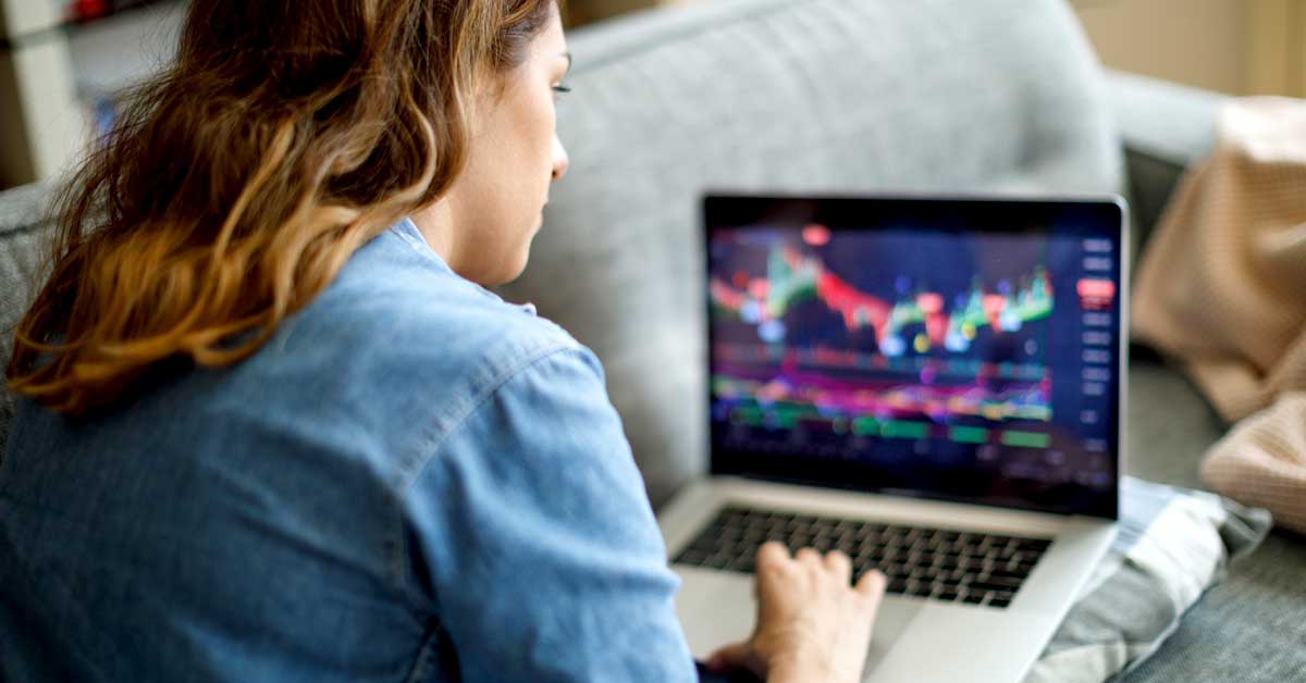 Woman looking at financial chart on a computer screen